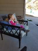 Blowing bubbles on the porch